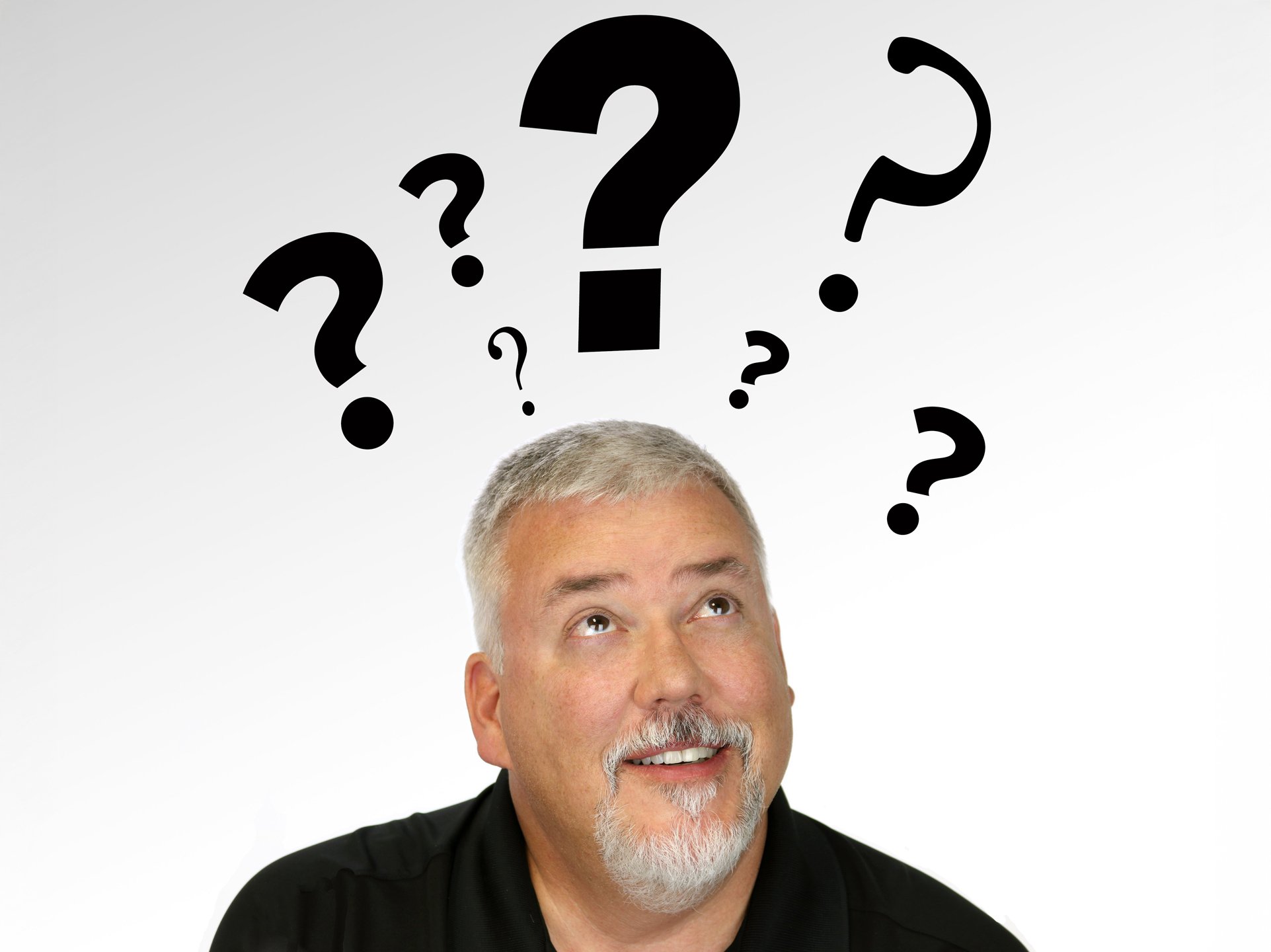 A man with a thoughtful expression looking up at floating question marks representing frequently asked questions.