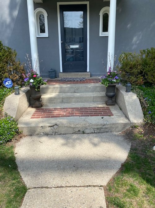 Front porch and steps with snow melting