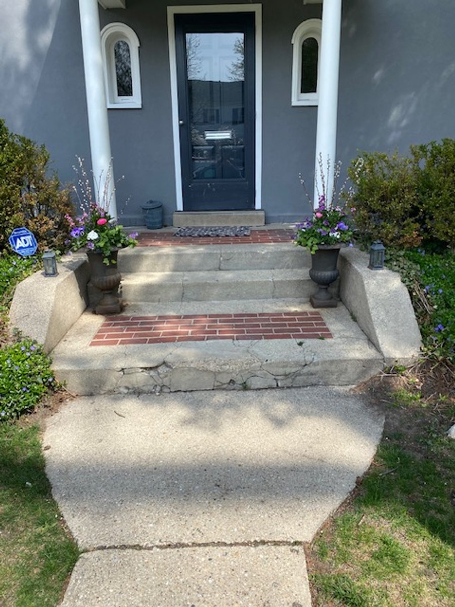Front porch and steps with snow melting