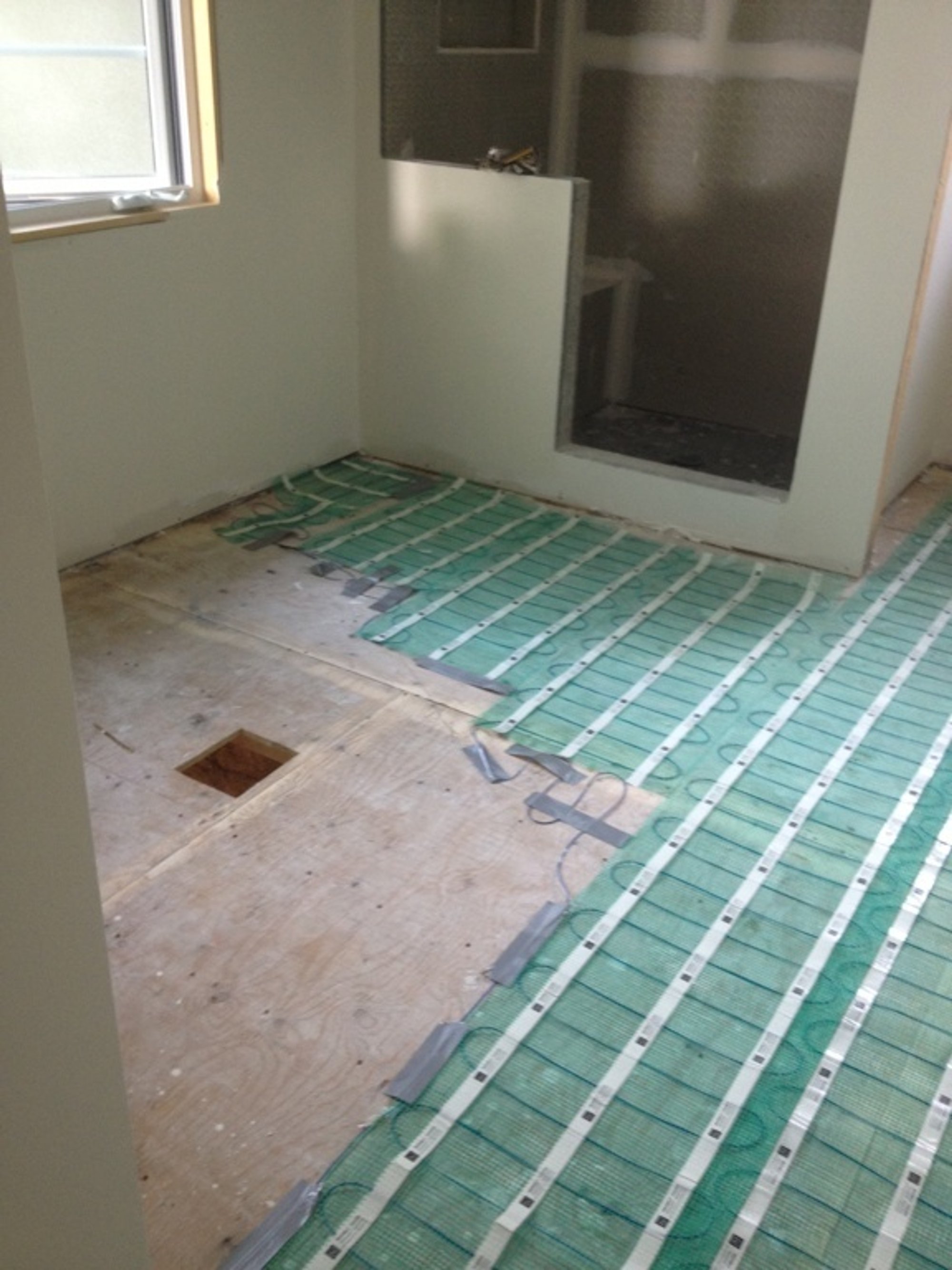 heated bathroom floor installation near shower enclosure NORTH YORK, ON
