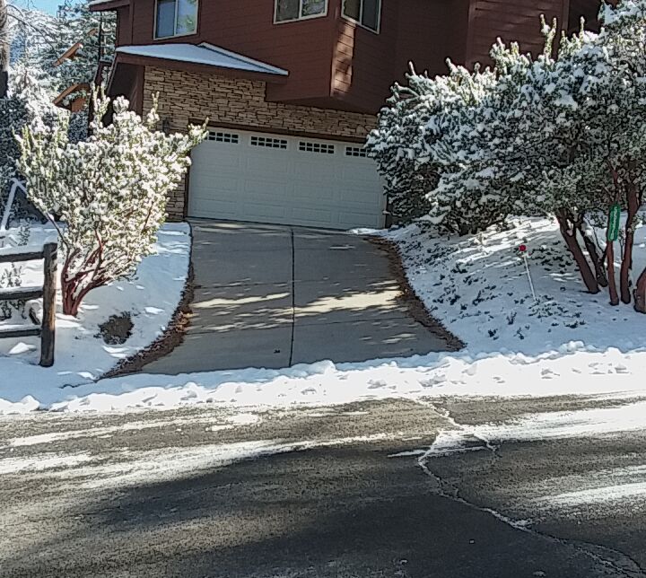 Finished heated concrete driveway in winter — snow melting system keeps surface clear in Idyllwild-Pine Cove, CA
