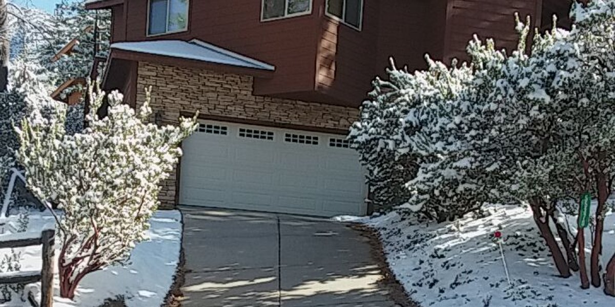 Heated Driveway in winter with snow melting system embedded in concrete