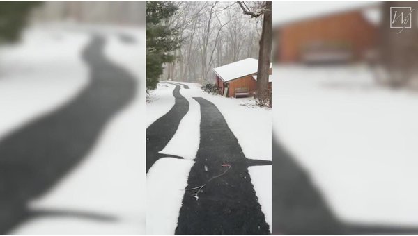 Heated Driveway System (Tire Tracks) in Use in an Asphalt Driveway