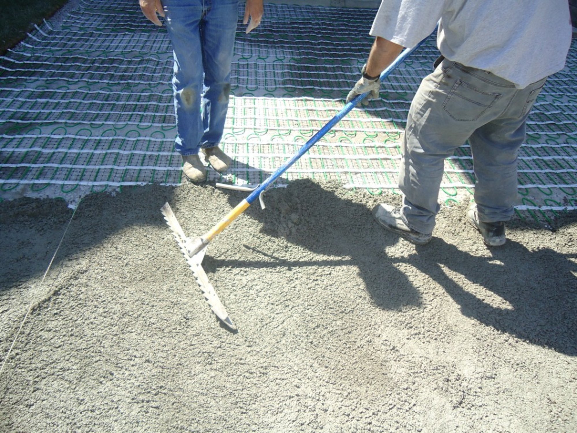 Heated Paver Driveway Installation spreading gravel sand VAUGHAN, ON
