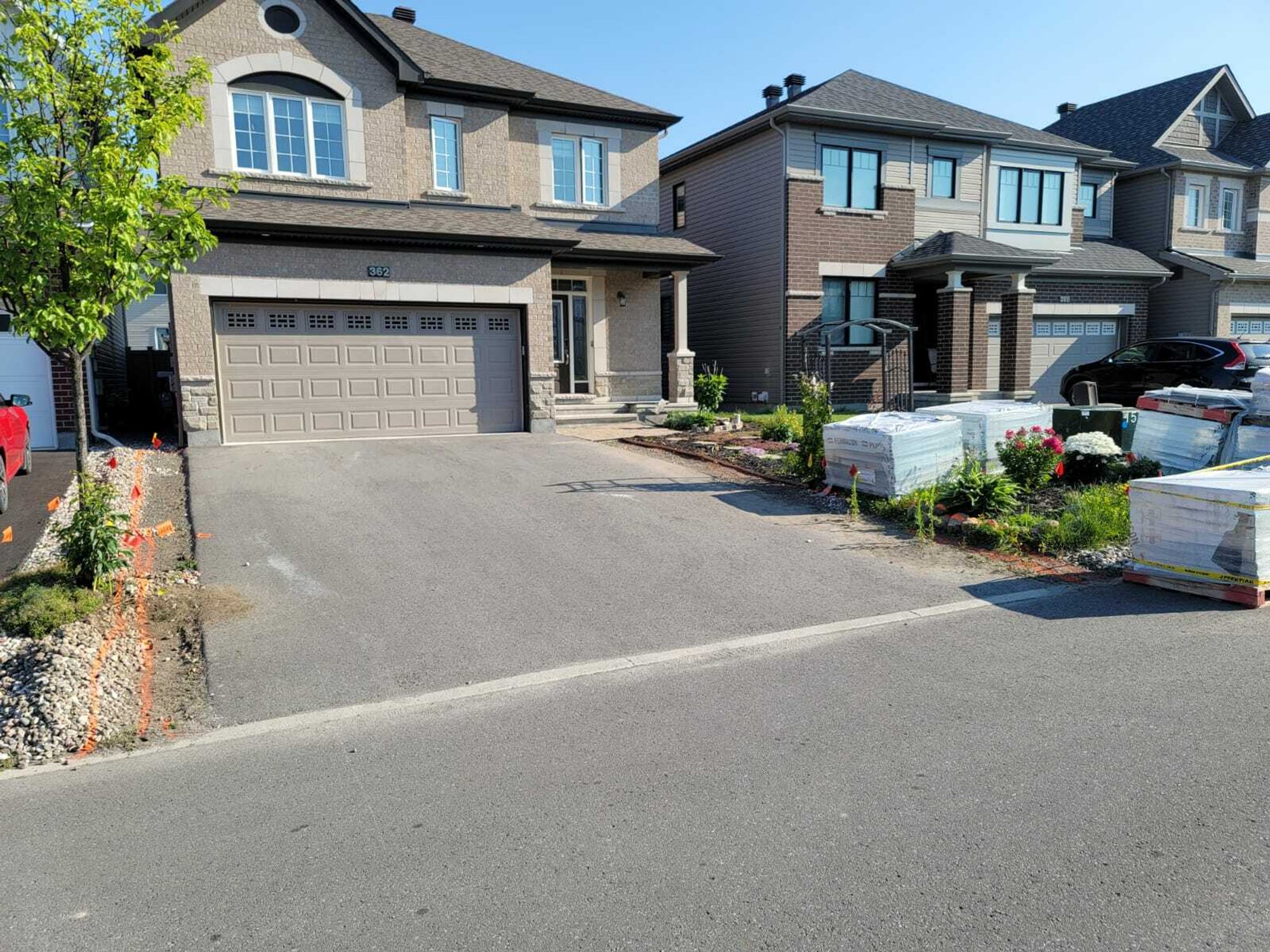 Heated Paver Driveway with before shot with concrete
