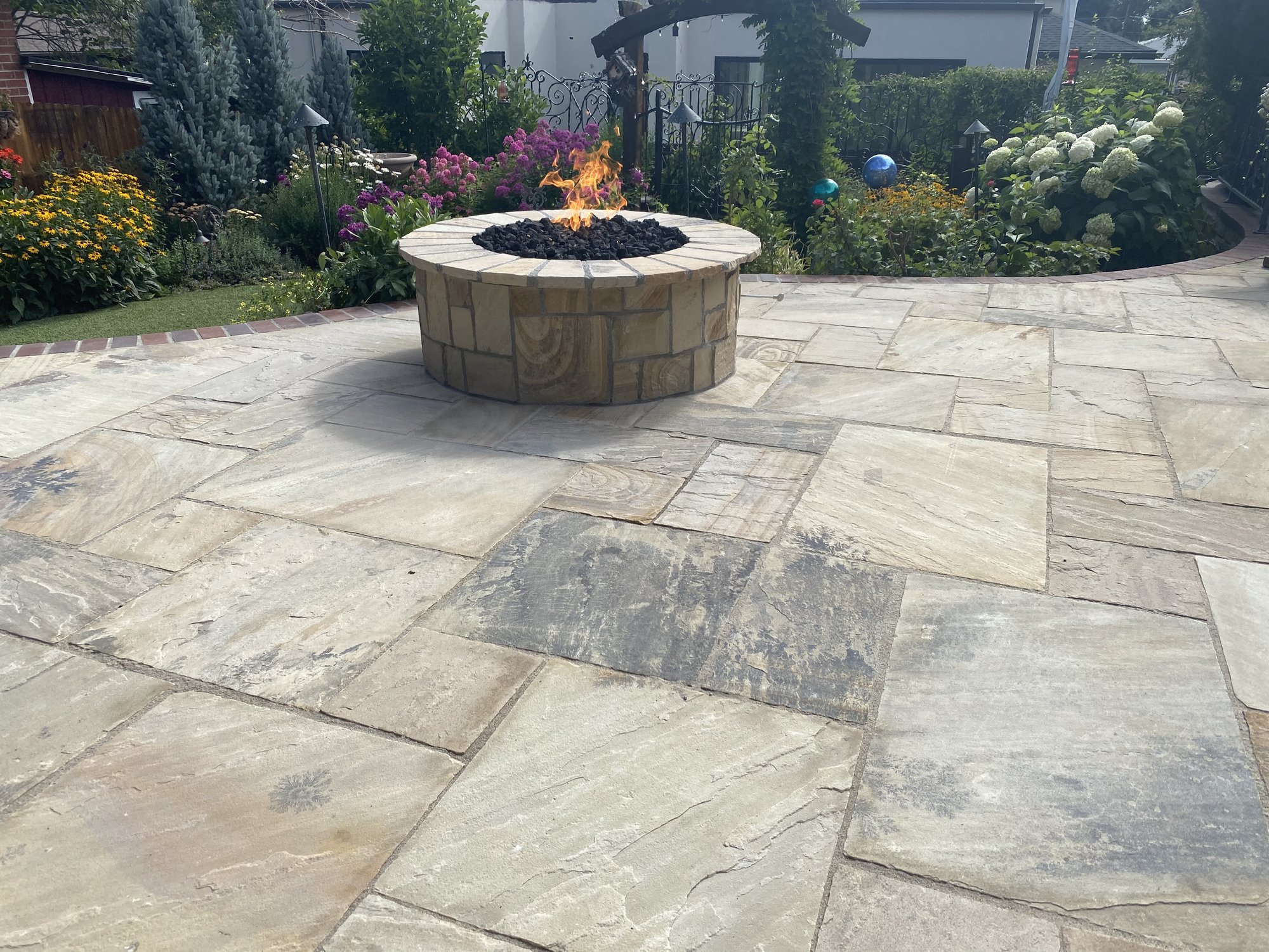 Heated paver patio with snow melt system and fire pit on