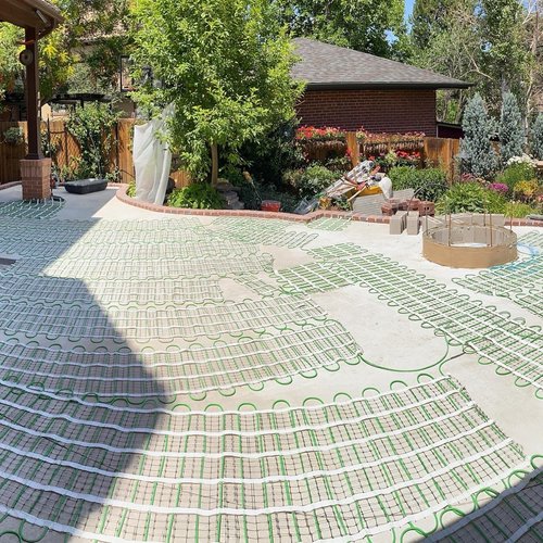 Heated paver patio with snow melt system mat configuration