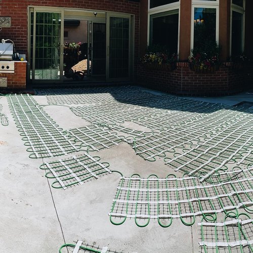 Heated paver patio with snow melt system mat layout