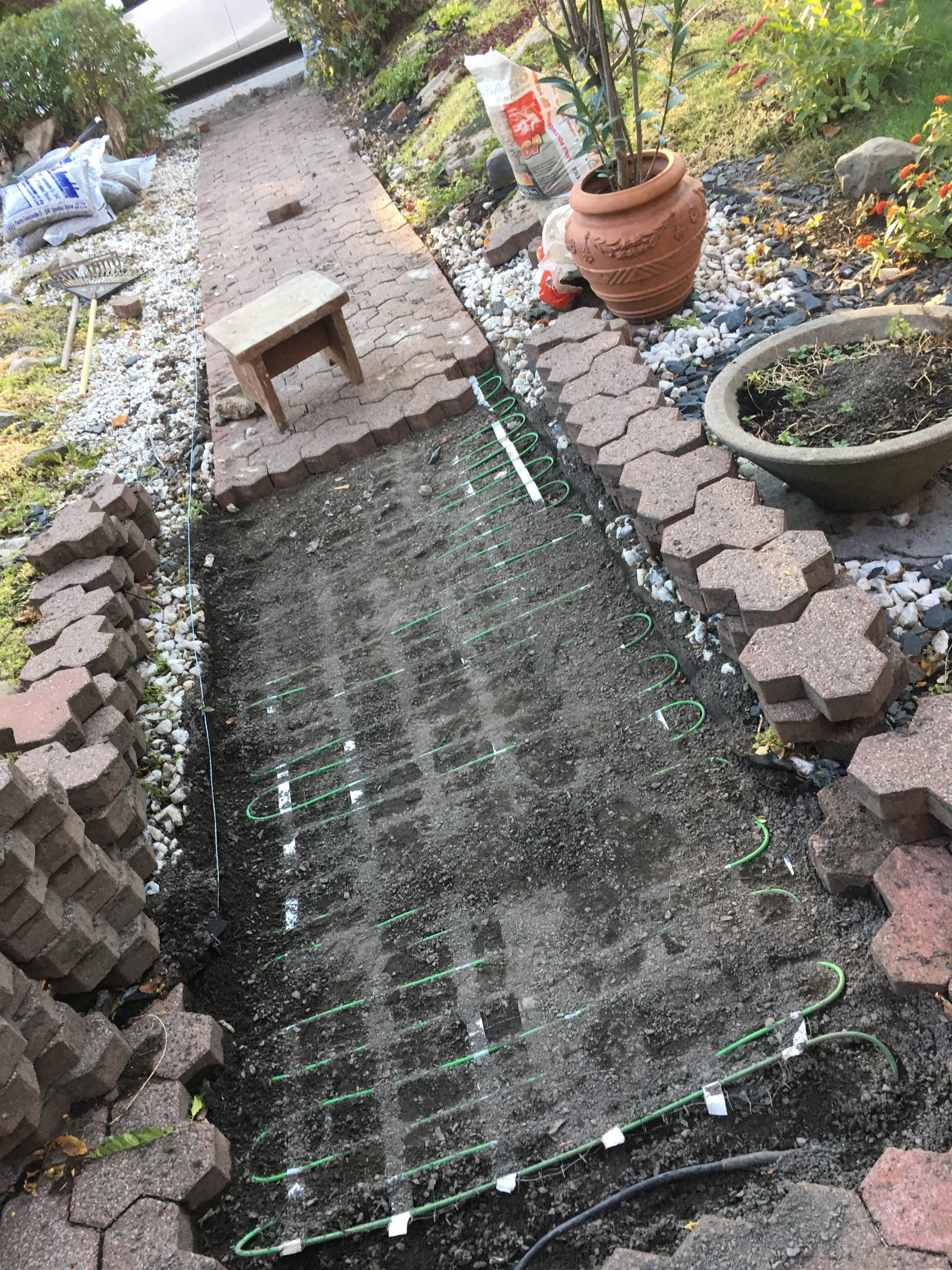 Heated paver walkway installation with snow melt mats