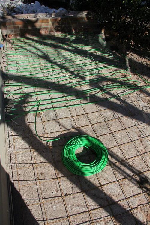 Snow melting cable installation for heated wheelchair ramp in Hudson, MA showing radiant heating system placement