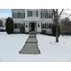 Heated paver walkway with snow melting mats during winter