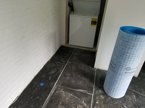 Heated Tile floor installed over uncoupling membrane for recreation room ALEXANDRIA, VA