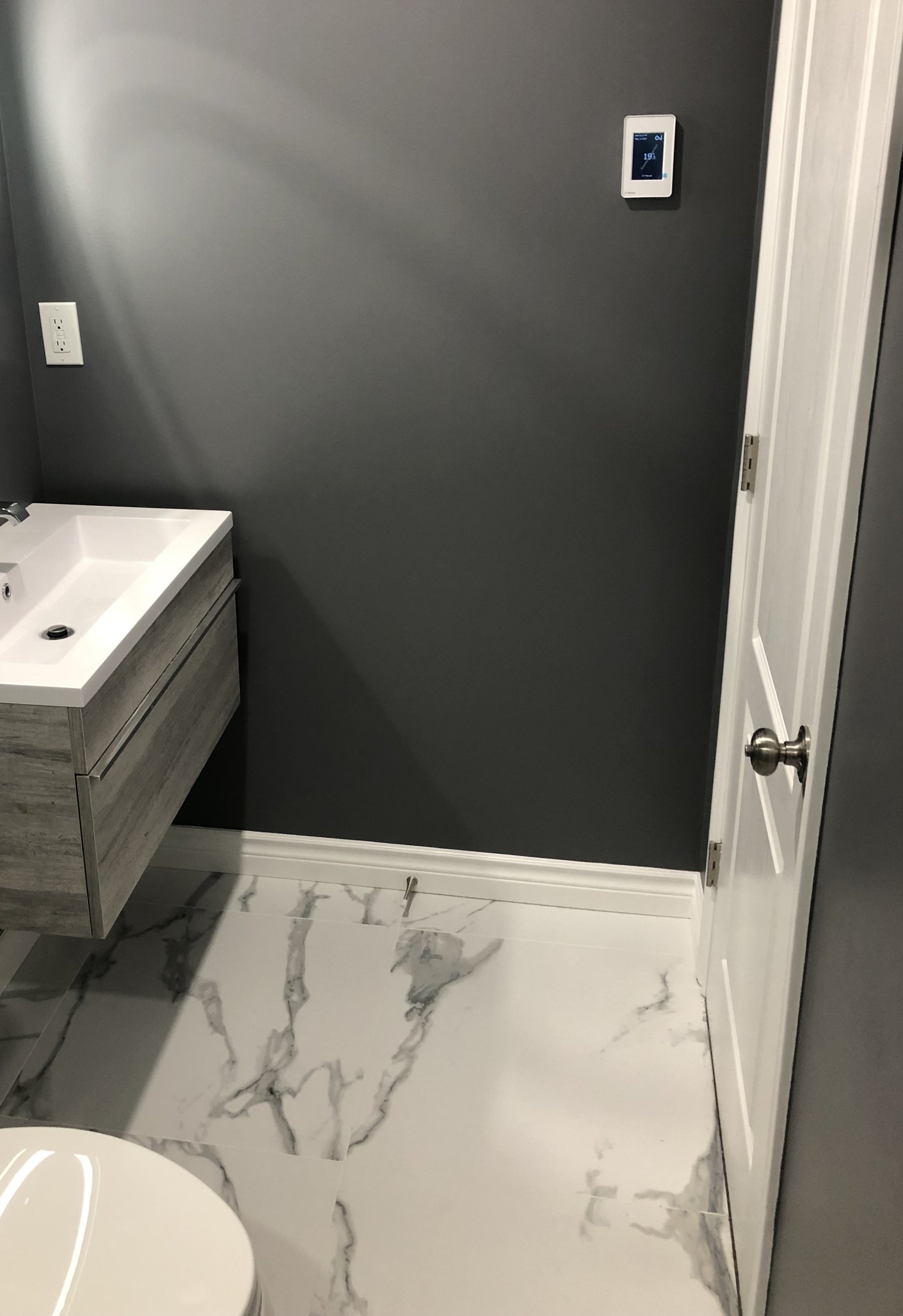 Heated Tile Installation for remodeled basement bathroom doorway WHITCHURCH-STOUFFVILLE, ON
