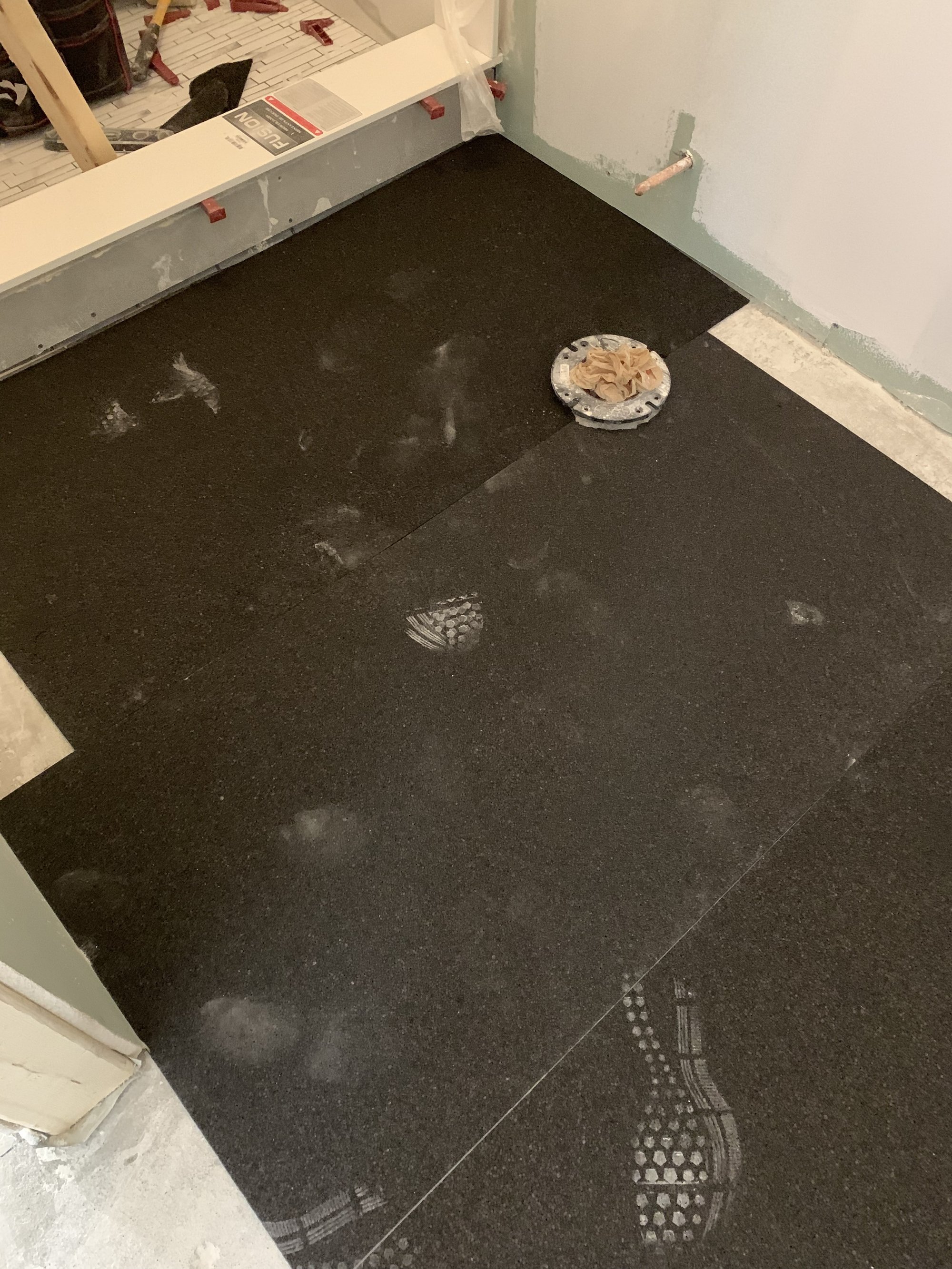 Heated Tile Installation for remodeled basement bathroom ThermalSheet layer