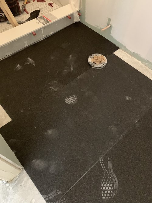 Heated Tile Installation for remodeled basement bathroom ThermalSheet layer