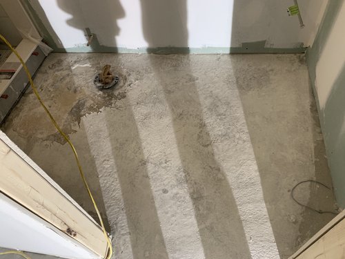 Heated Tile Installation for remodeled basement bathroom before shot