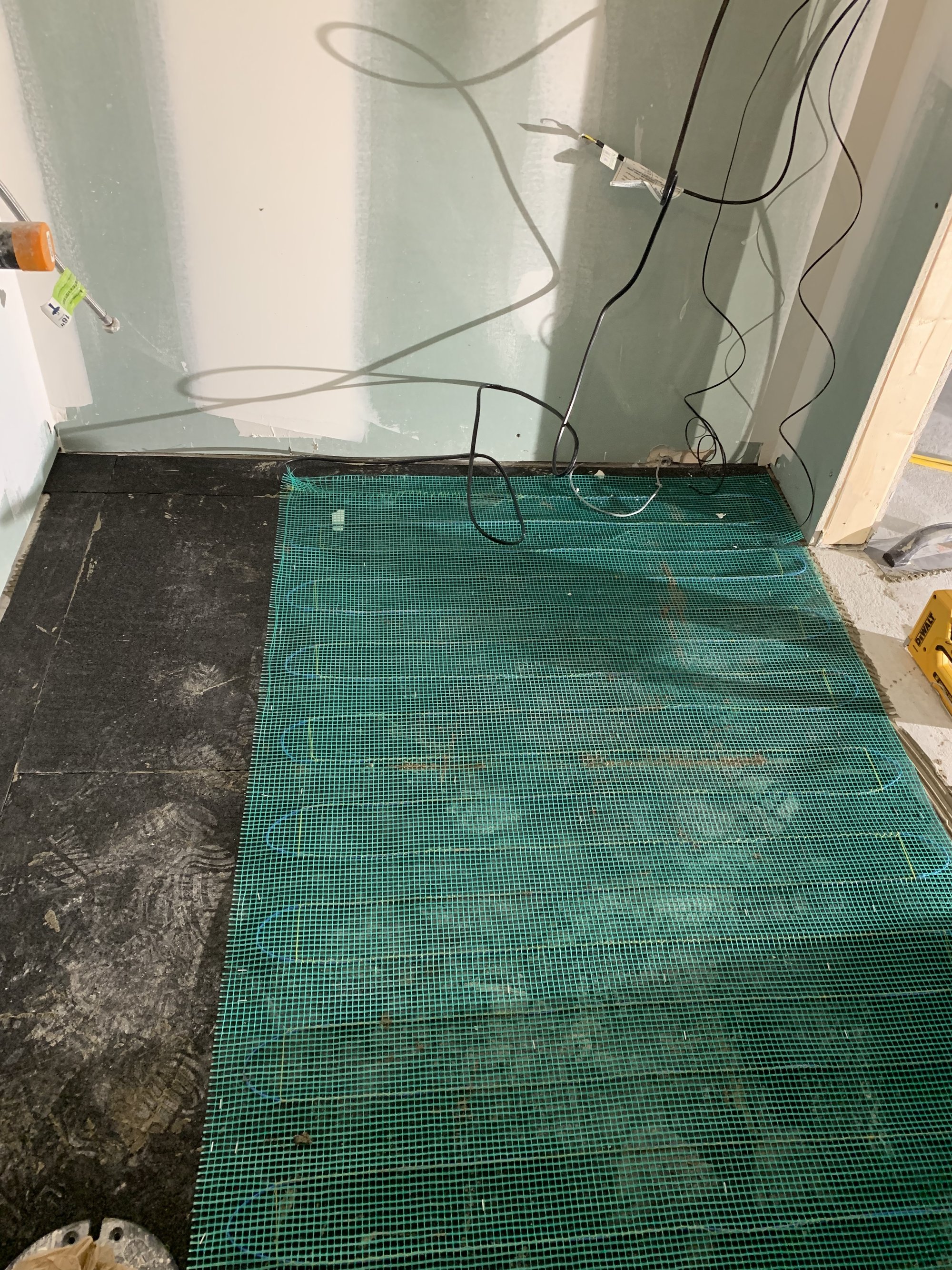 Heated Tile Installation for remodeled basement bathroom tempzone easy mat