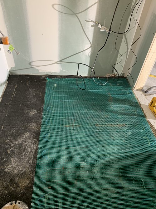 Heated Tile Installation for remodeled basement bathroom tempzone easy mat