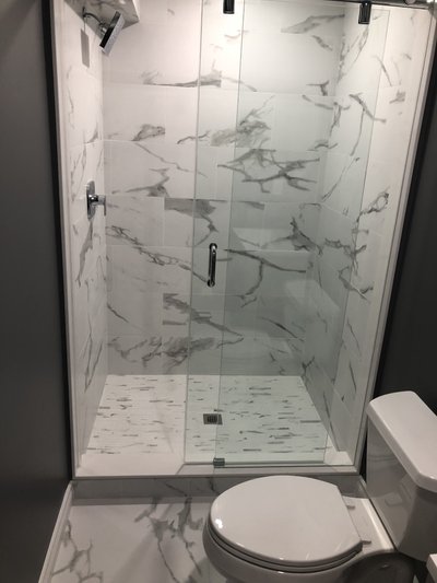 Heated Tile Installation for remodeled basement bathroom wide shot