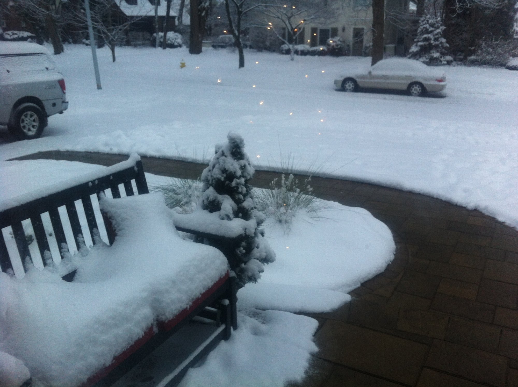 Heated walkway and porch with pavers during wintertime with bench