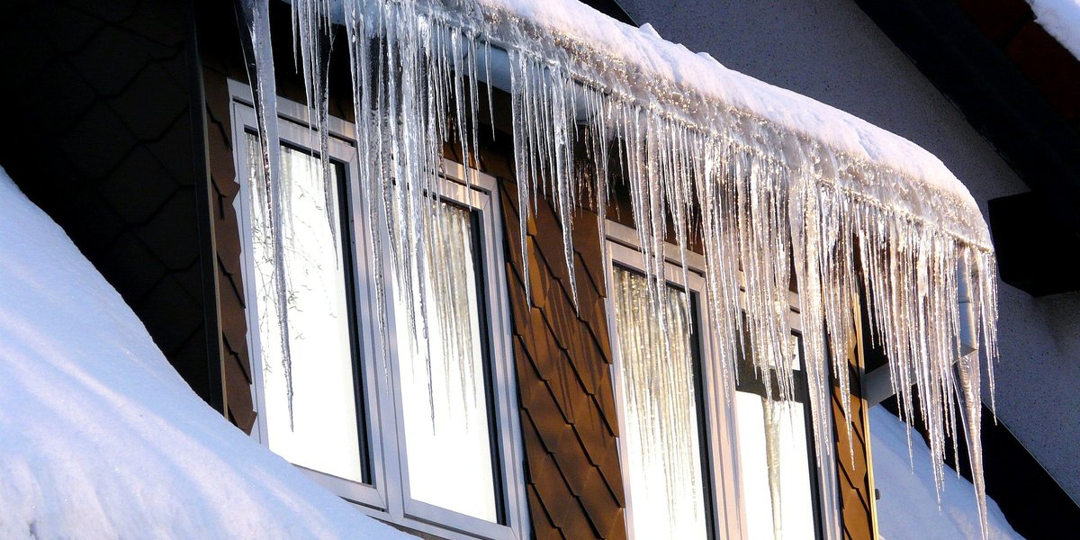 Ice dam on roof during winter