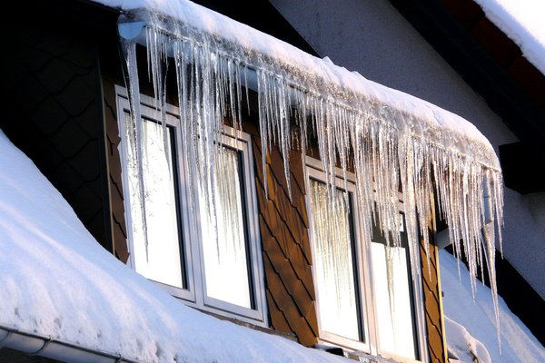 Ice dam on roof during winter