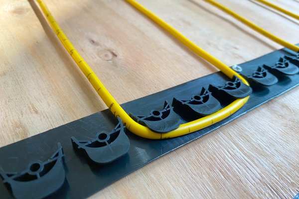 TempZone Ruler Cable with GripStrip on wood subfloor Installation