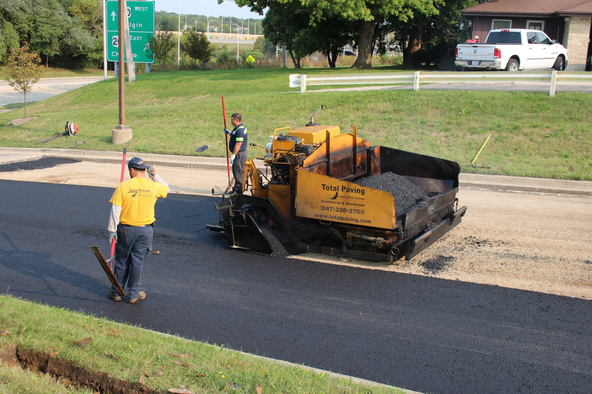 Preparing asphalt road before install and paving final layer after installation of snow melt system (18)