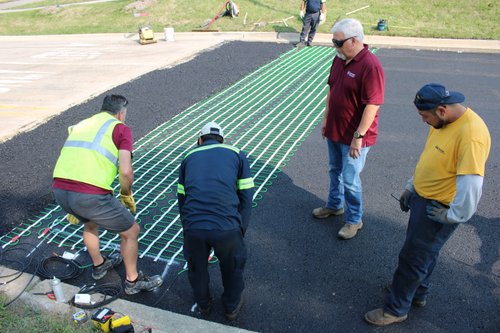 Jain Society Snow Melt Install Laying out snow melt mats (12)