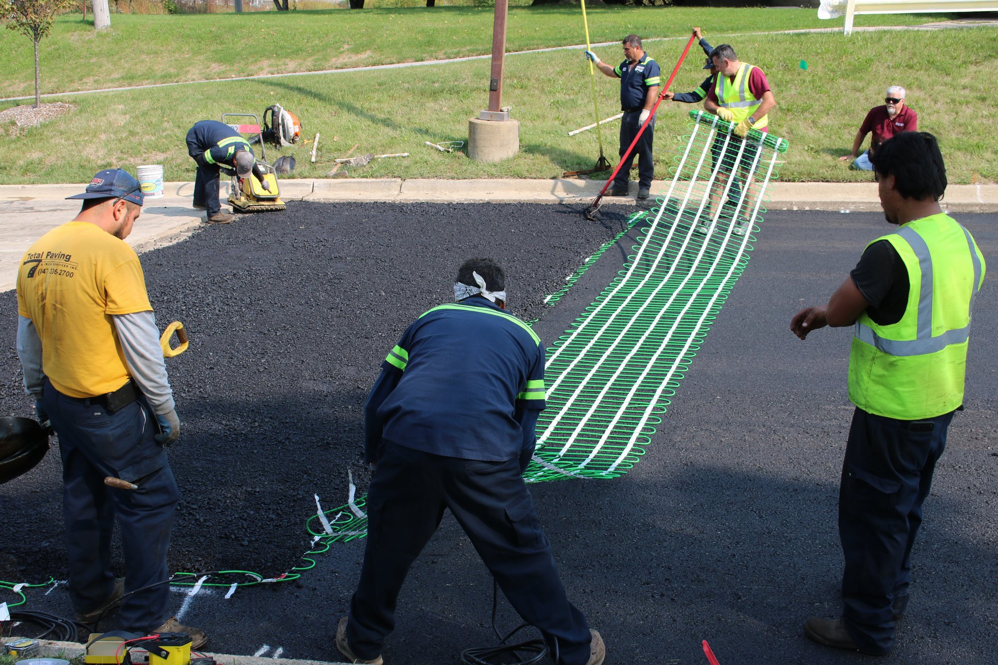 Jain Society Snow Melt Install Laying out snow melt mats