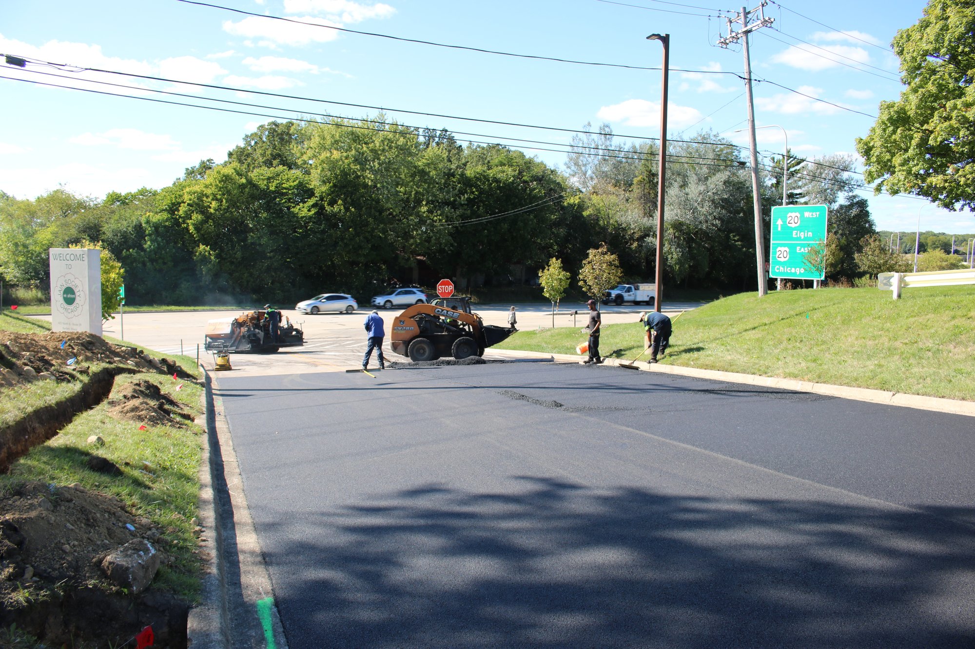 Preparing asphalt road before install and paving final layer after installation of snow melt system (10)