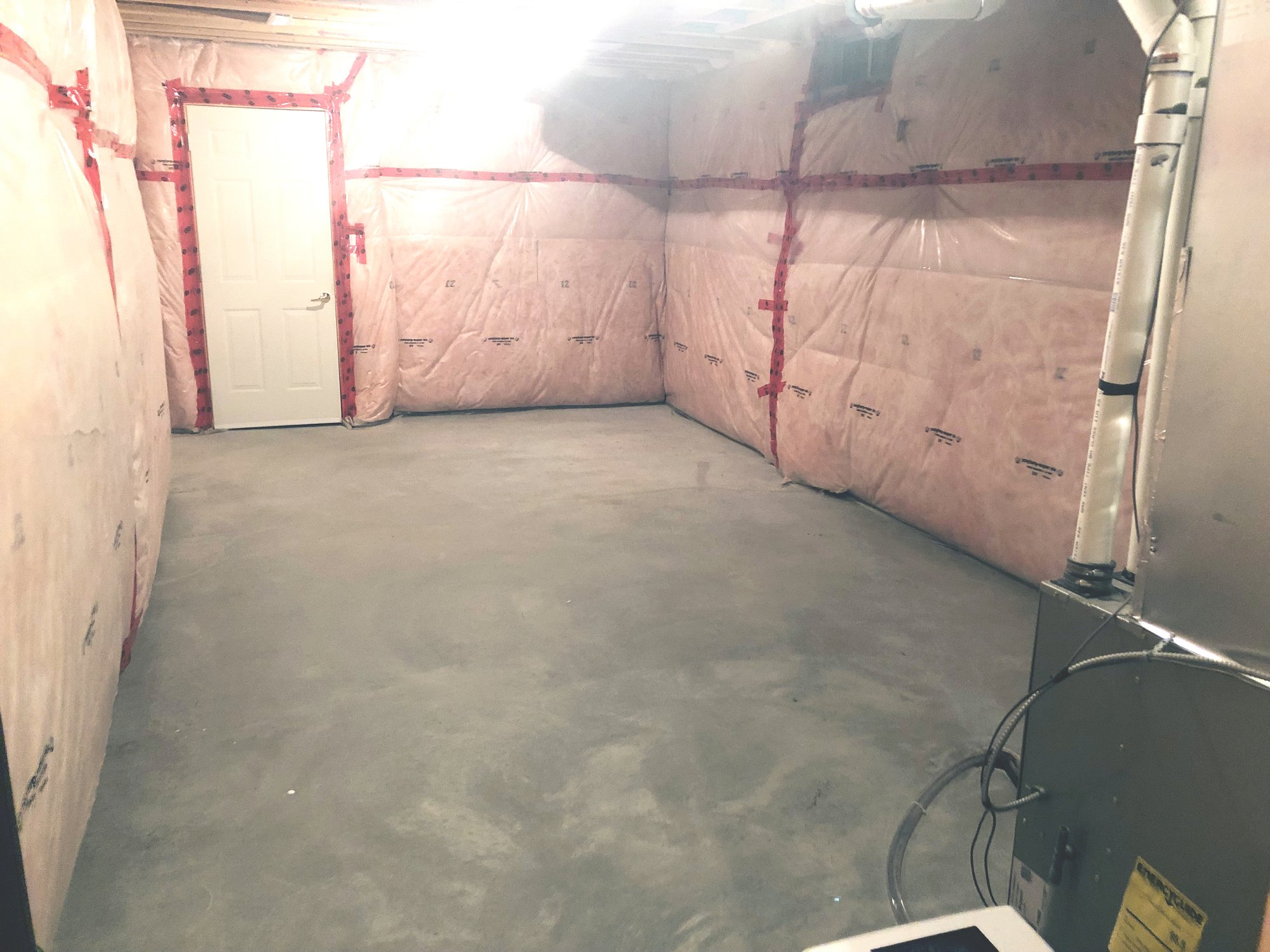 Installation of Luxury Vinyl Tile for Heated Basement Bedroom before shot
