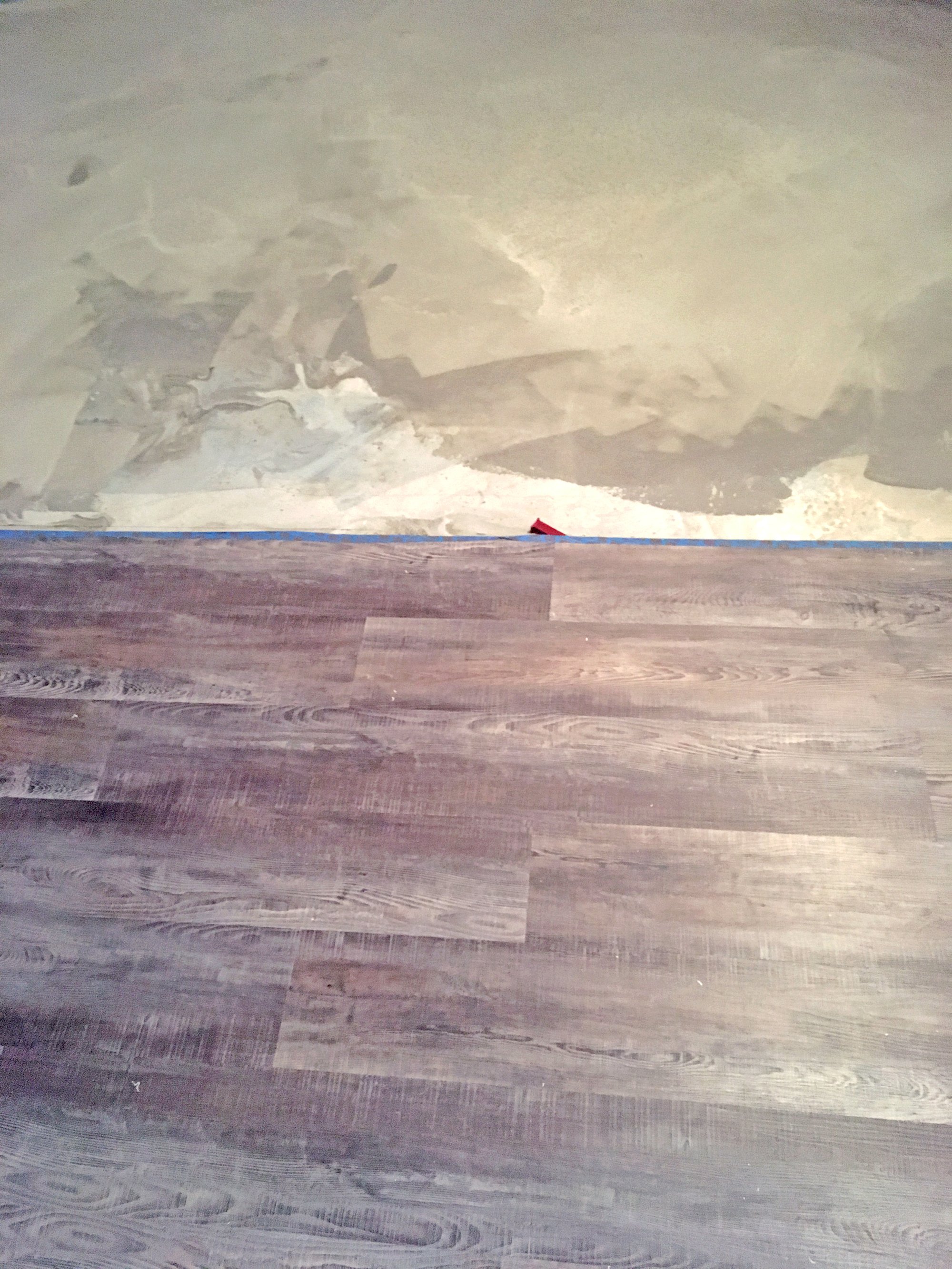 Installation of Luxury Vinyl Tile for Heated Basement Bedroom layers close up