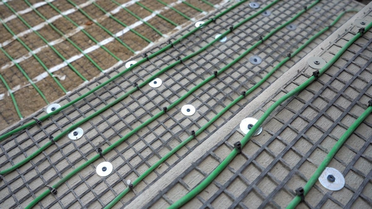 Installation of snow melt system under pavers angled shot on stairs