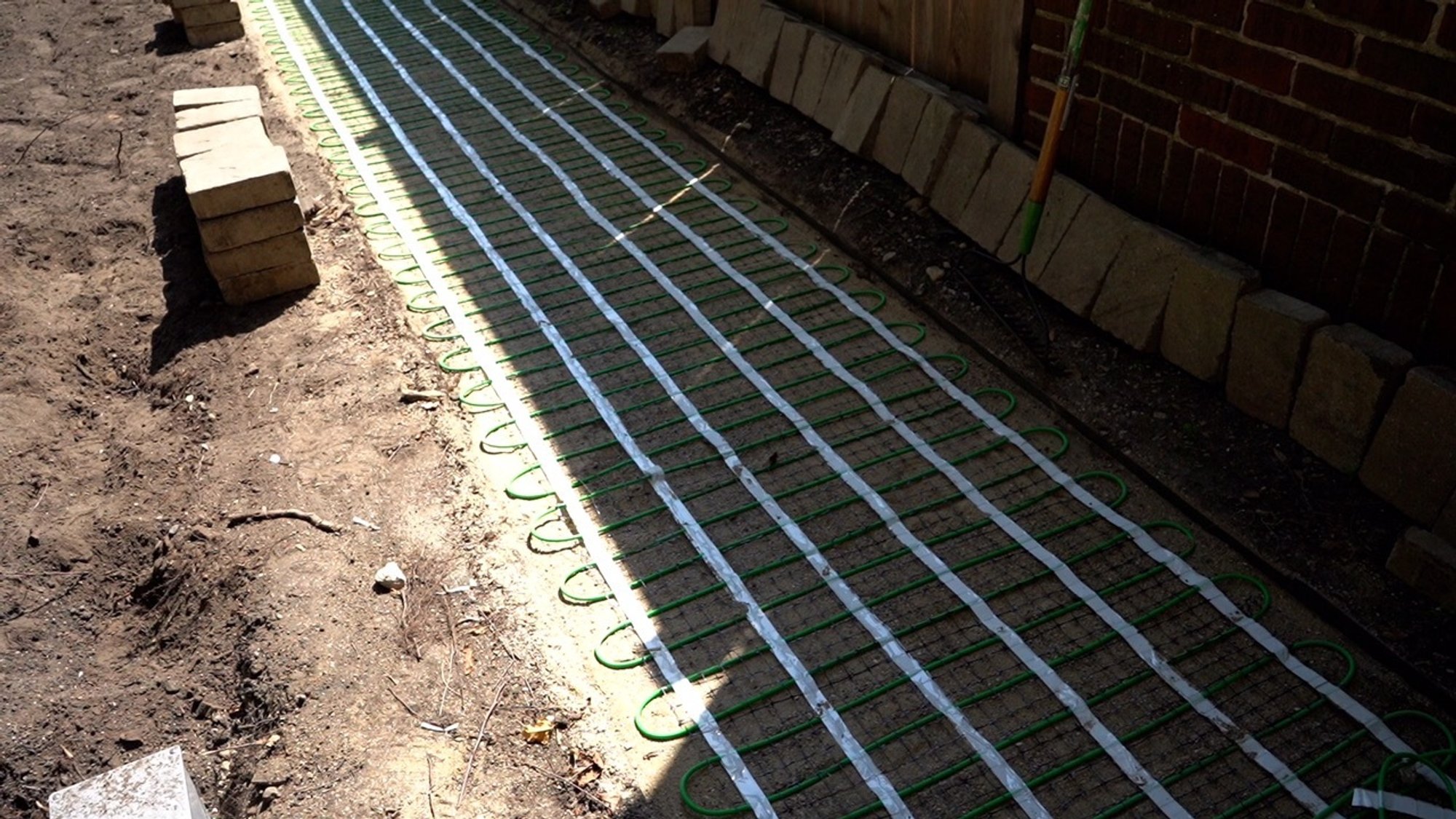 Installation of snow melt system under pavers for a walkway EVANSTON, IL