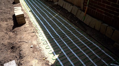 Installation of snow melt system under pavers for a walkway EVANSTON, IL