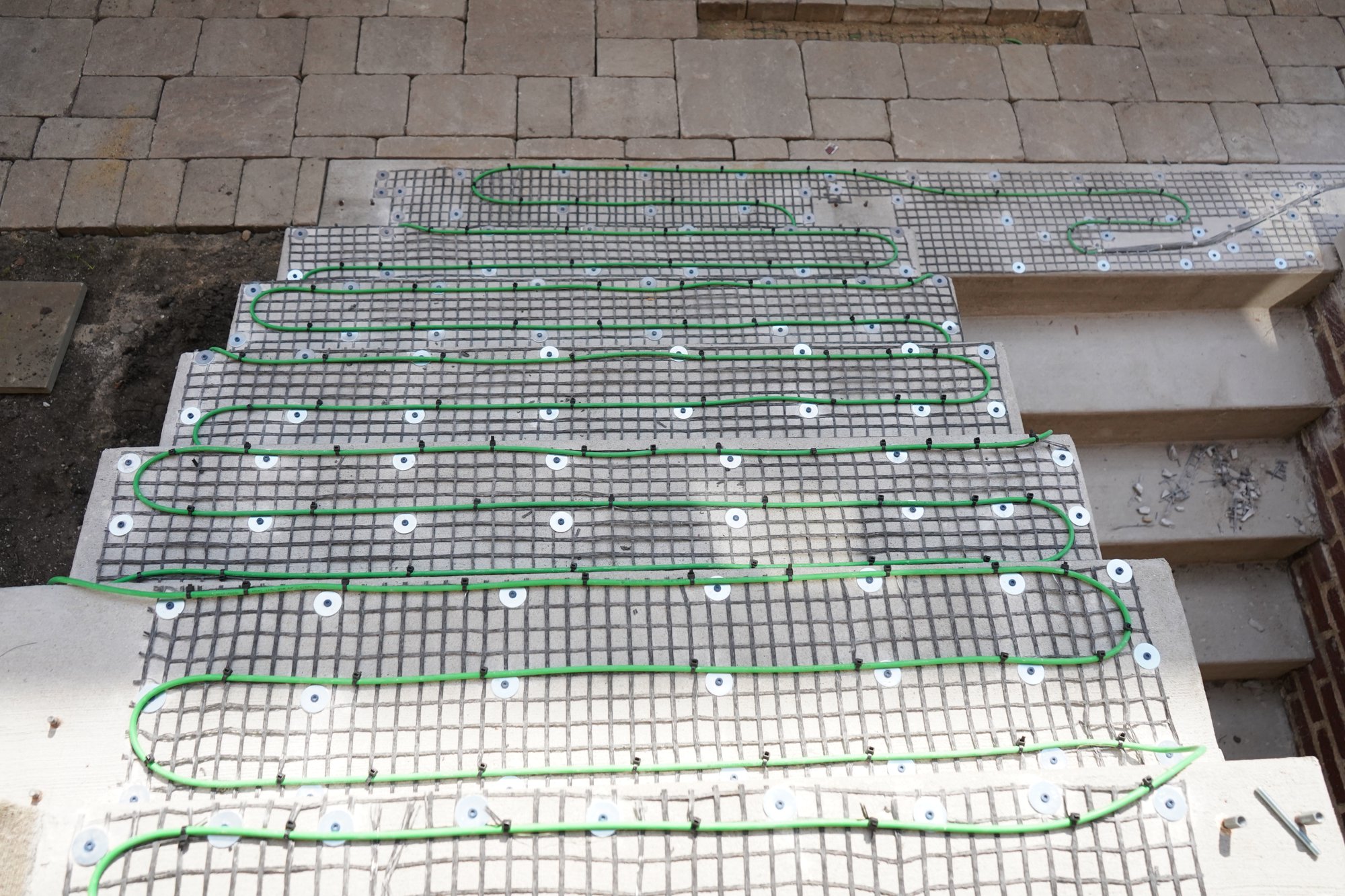 Installation of snow melt system under pavers for landing and stairs II EVANSTON, IL