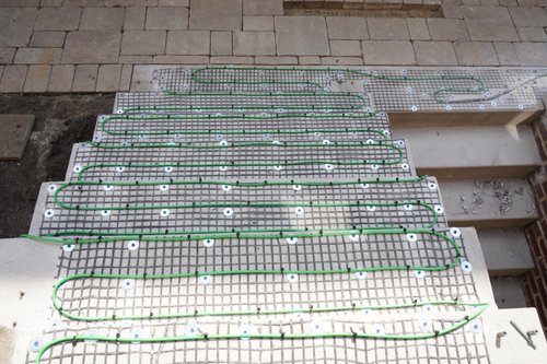 Installation of snow melt system under pavers for landing and stairs II EVANSTON, IL