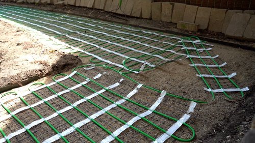 Installation of snow melt system under pavers on walkway corner EVANSTON, IL