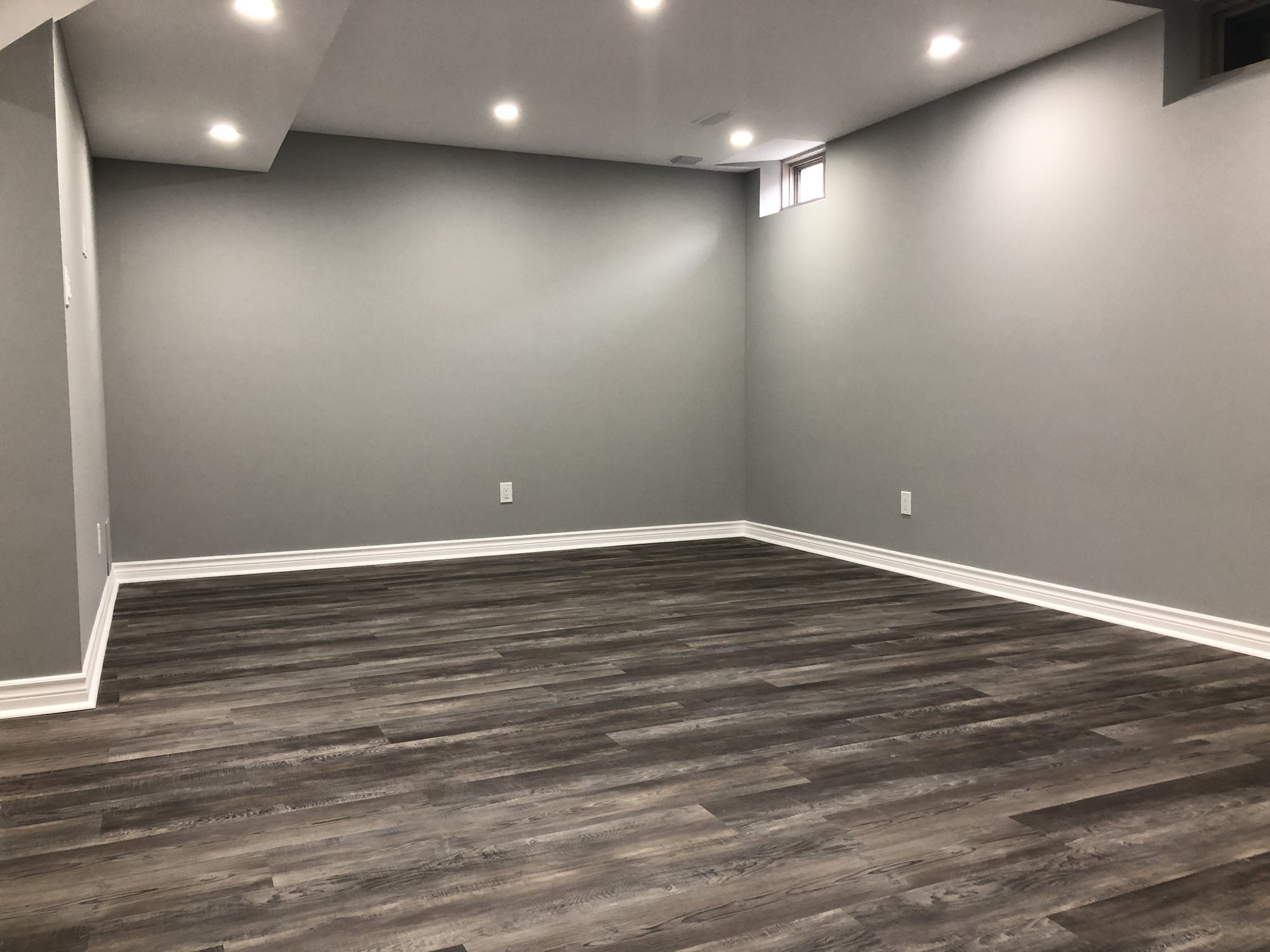 Installing Luxury Vinyl Tile for Heated Basement Playroom before furniture