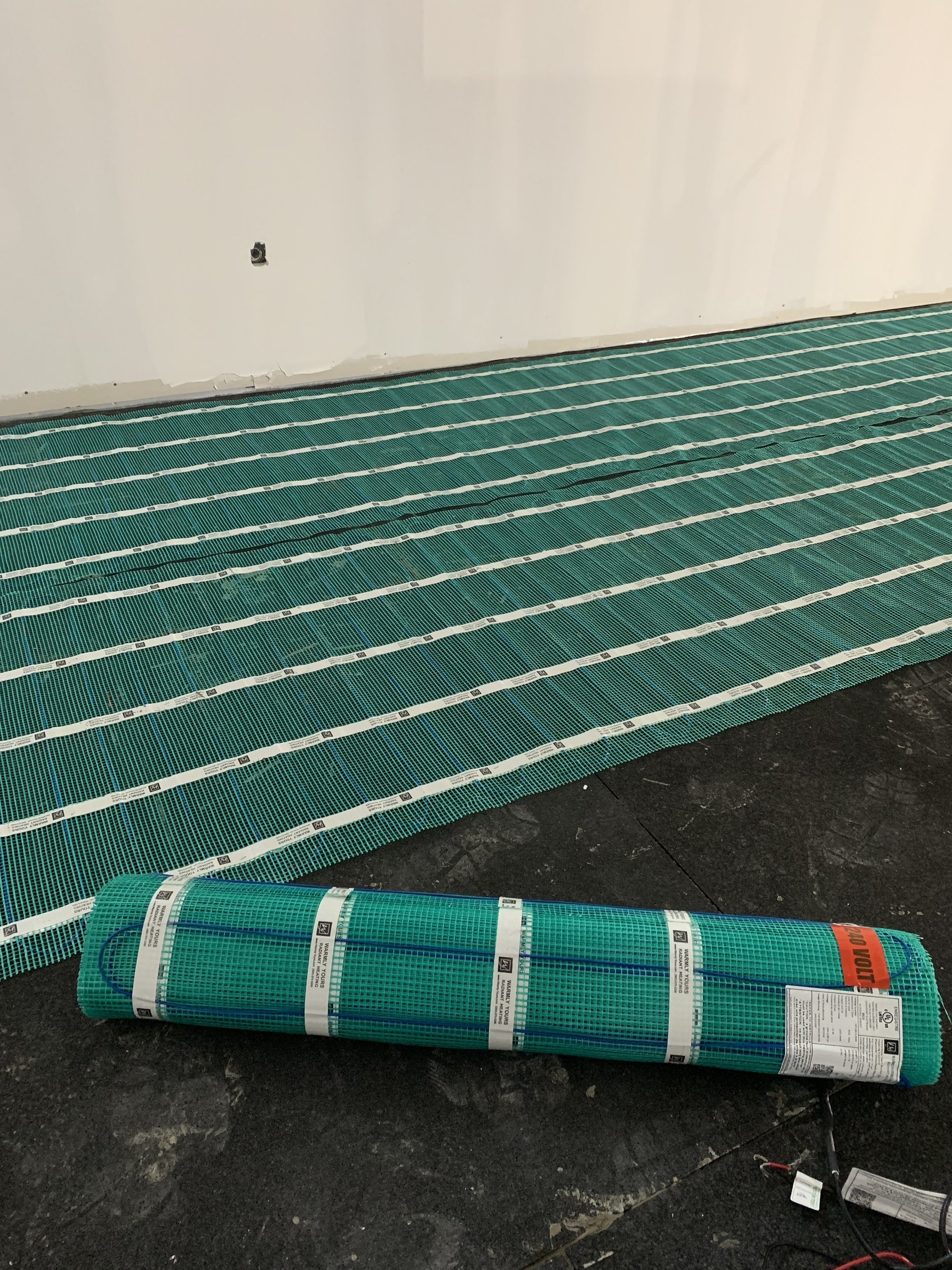 Installing Luxury Vinyl Tile for Heated Basement Playroom tempzone flex roll displayed
