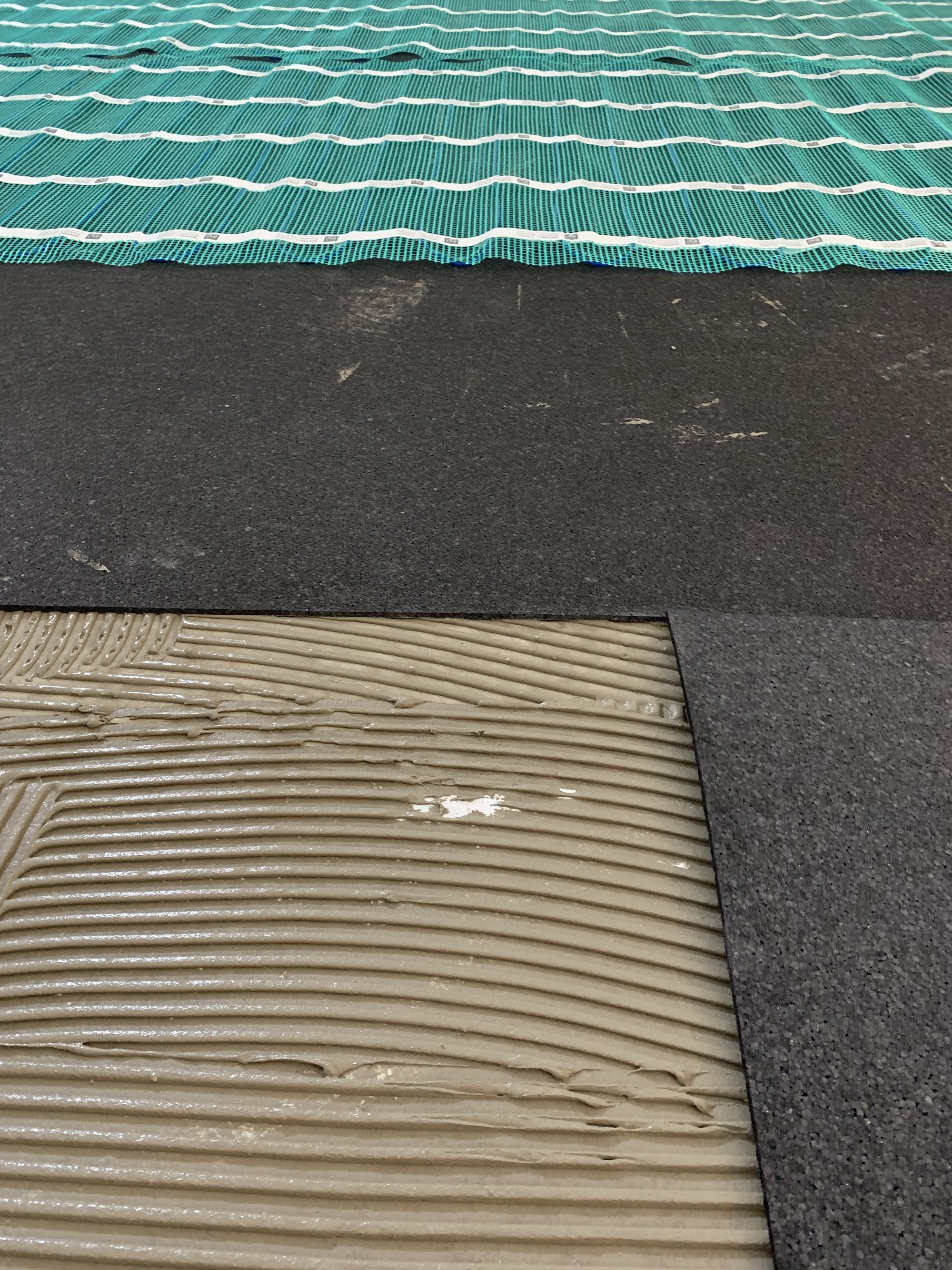 Installing Luxury Vinyl Tile for Heated Basement Playroom layers of floor