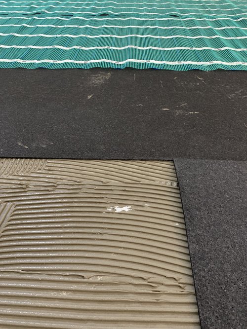 Installing Luxury Vinyl Tile for Heated Basement Playroom layers of floor