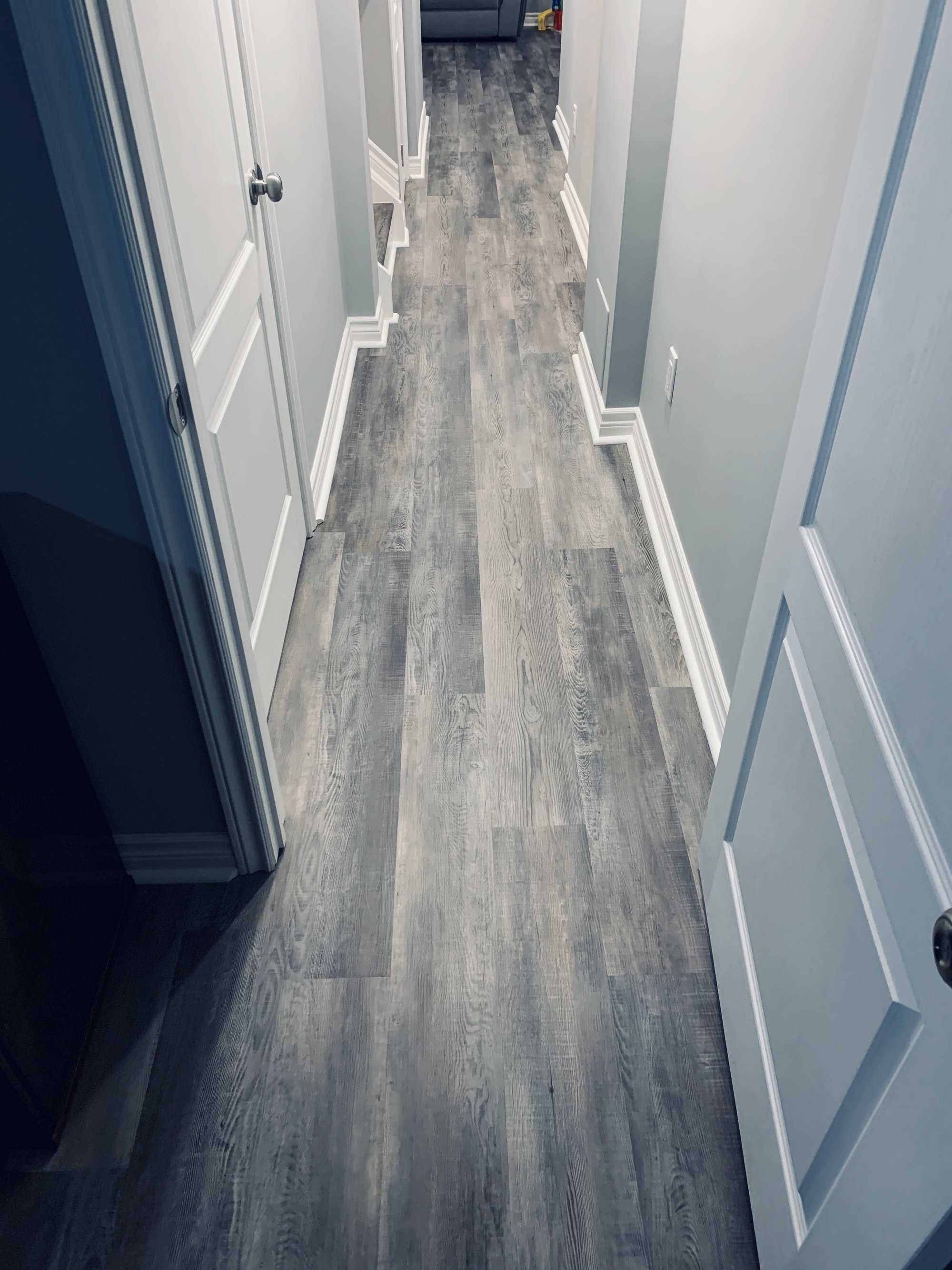 Installing Luxury Vinyl Tile for Heated Basement Playroom hallway