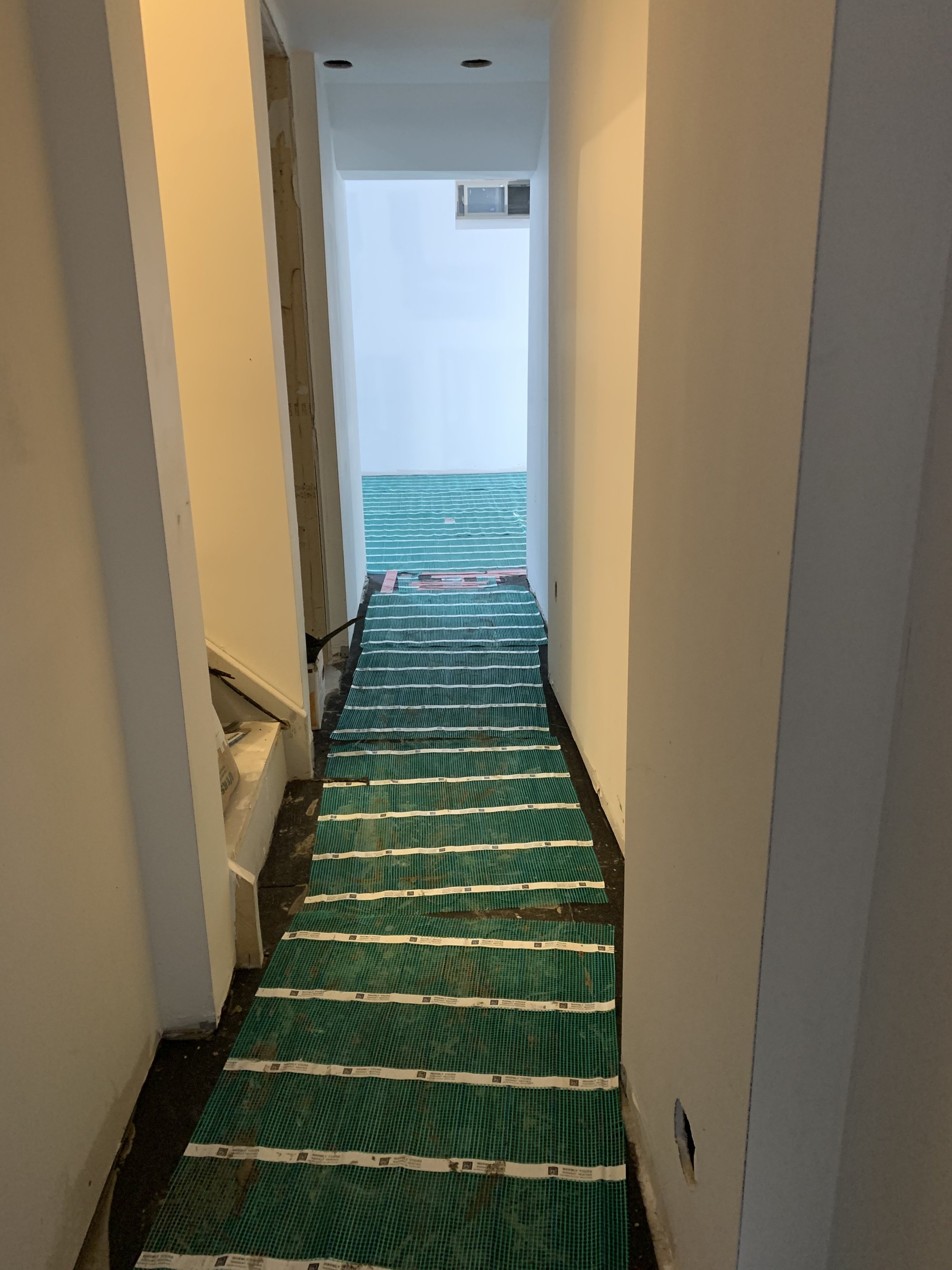 Installing Luxury Vinyl Tile for Heated Basement Playroom hallway with tempzone flex roll