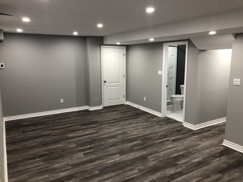 Installing Luxury Vinyl Tile for Heated Basement Playroom near bathroom