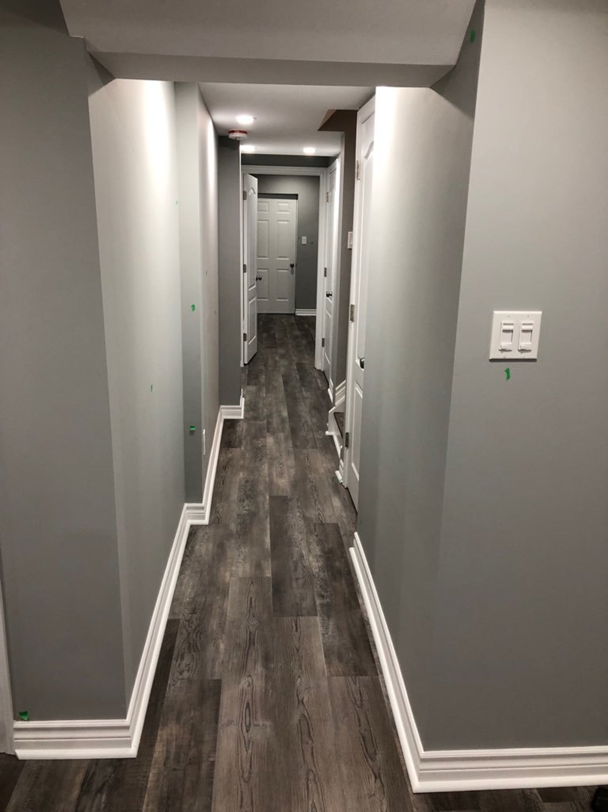 Installing Luxury Vinyl Tile for Heated Basement hallway