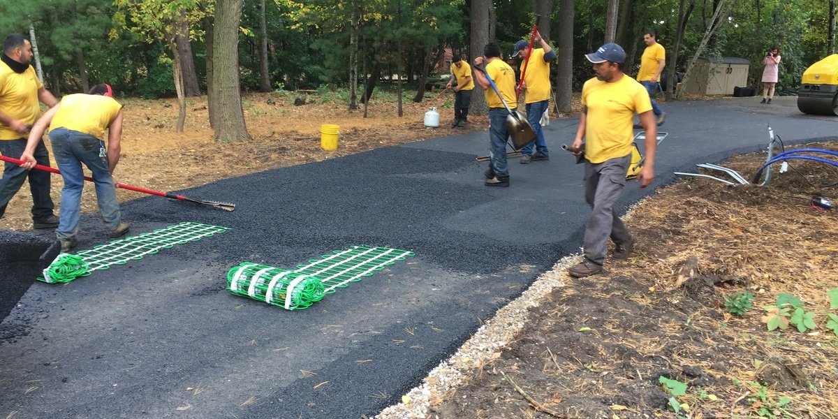 Installing snow melt mats on asphalt driveway