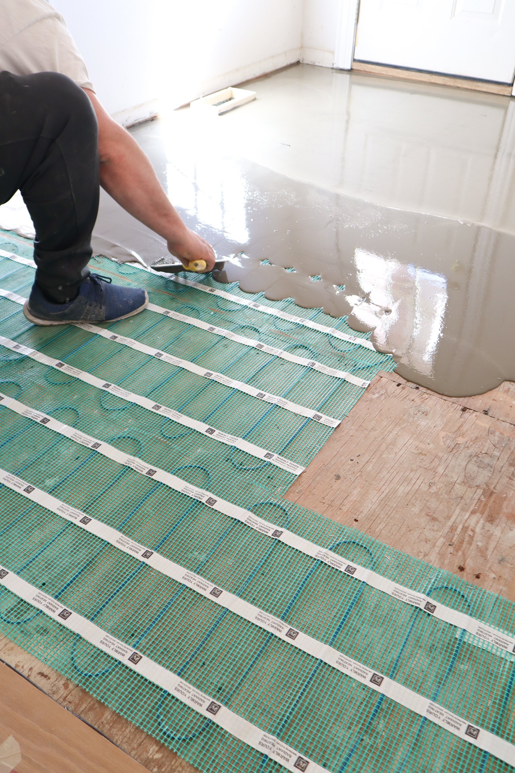 Installing TempZone Flex Roll floor heating mats under self-leveling cement OAK LAWN, IL