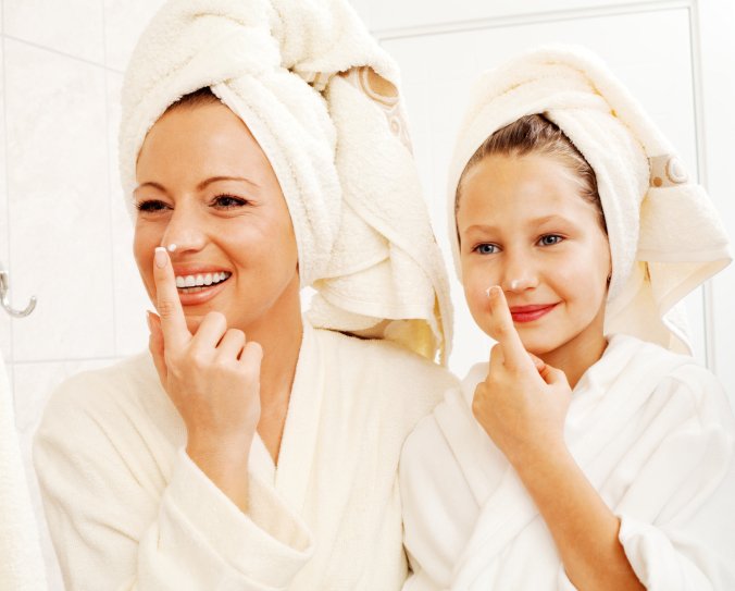 Mother and daughter enjoying a fog-free mirror